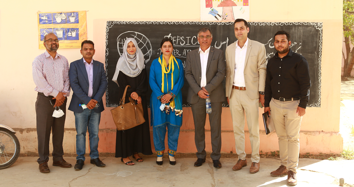 Image of Sonia with project partners from WaterAid, PepsiCo Pakistan and PCRWR.