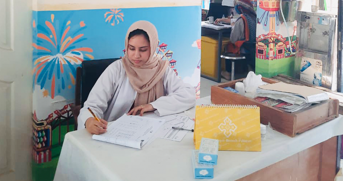 Zehra Batool working at a desk