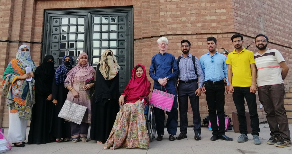 Specular team in front of a building